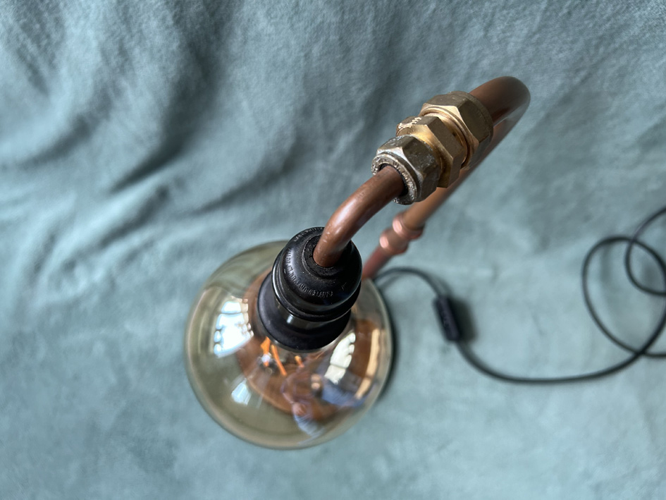 Lamp met greep en rat