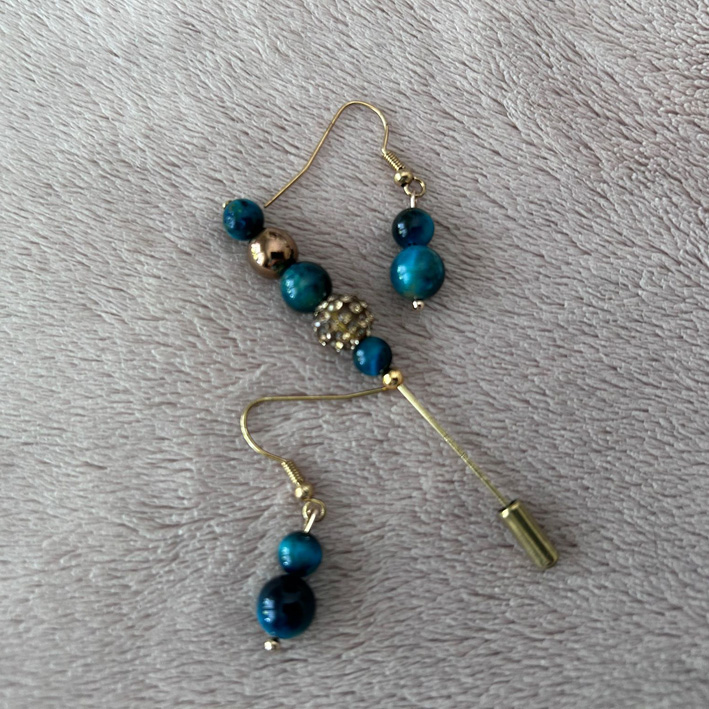 Pinbroche en oorbellen galaxy