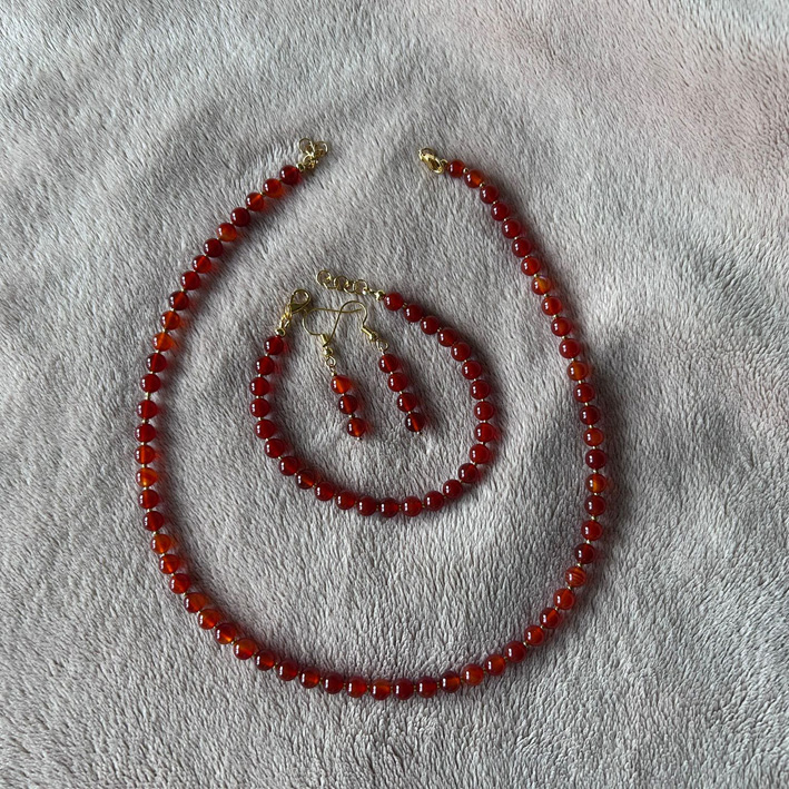 Oranje set: ketting armband en oorbellen