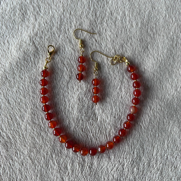 Oranje armband met oorbellen